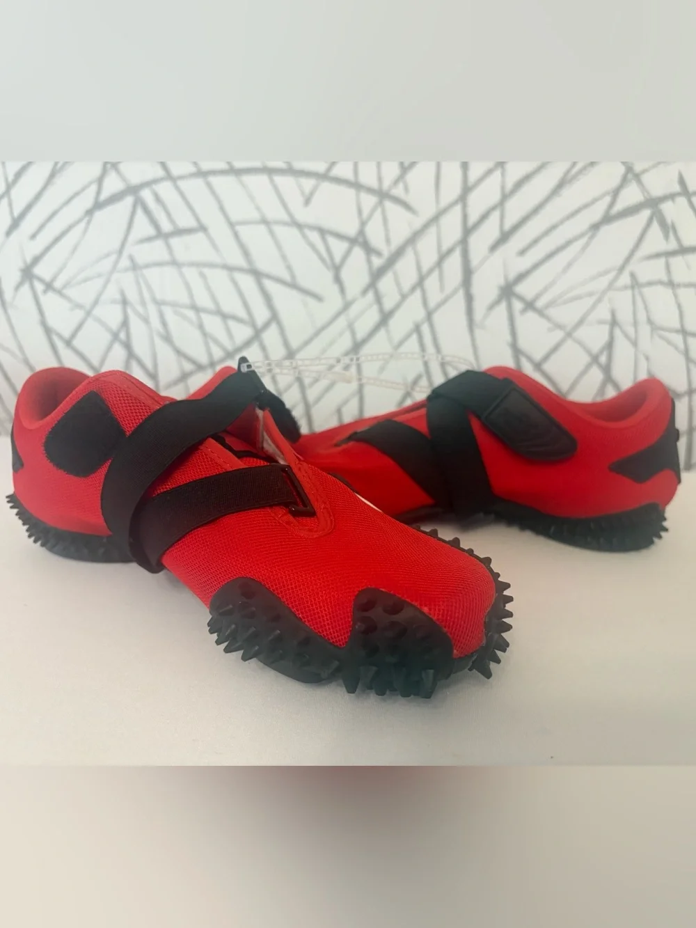 PUMA Mostro OG Sneakers. Vibrant  Red with a Unique Spike Sole.